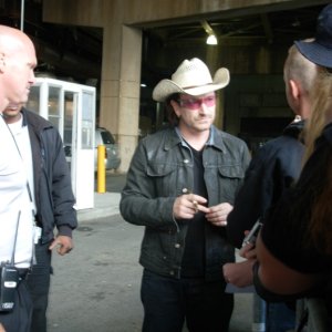 Bono signing autographs