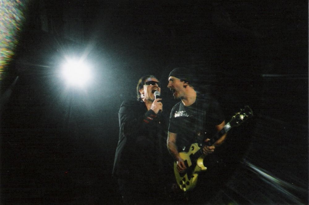 Bono and Edge singing