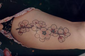 Chinese flowers on left arm