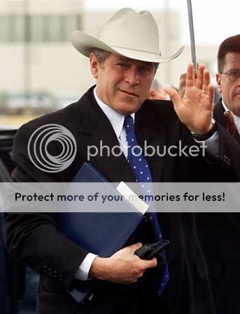 bush-in-cowboy-hat-and-folders.jpg