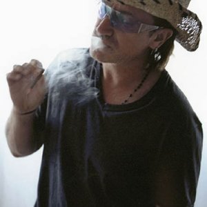 Bono smoking in straw hat