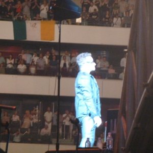 Bono standing behind Larry streets