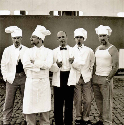 Brian-Eno-with-U2-Chefs-hat.jpg
