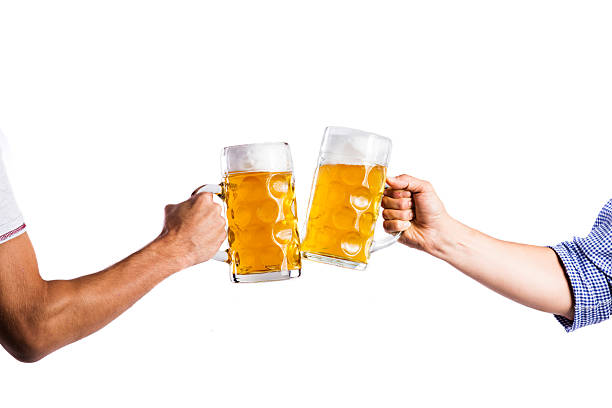 two-unrecognizable-men-clinking-with-beer-mugs-studio-shot-picture-id603314468