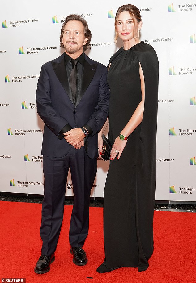 65217631-11499745-Better_man_Eddie_Vedder_and_wife_Jill_McCormick_posed_on_the_red-a-106_1670136620332.jpg