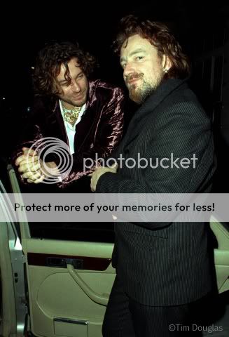 Bono-MichaelHutchence-SonyChristmasParty-HamiltonsGallery-Mayfair-London-19Dec1994copyTimDouglas-CameraPressLondon1wm.jpg~original