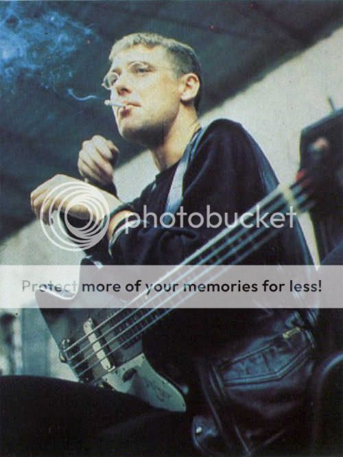 smoking_and_holding_his_bass.jpg